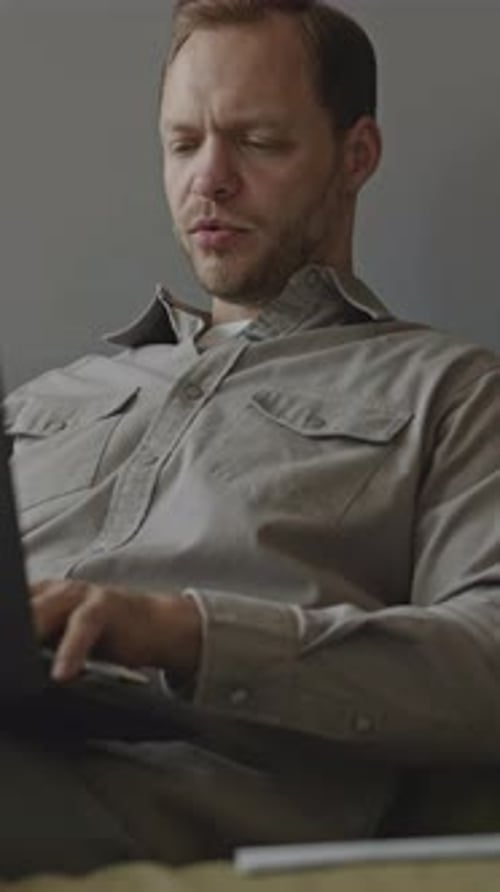 Adult Man Engaged in Virtual Meeting Conversation