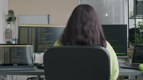 Portrait of Female System Administrator Coding at Workplace