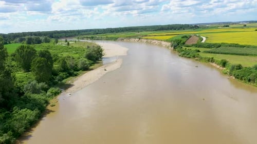 Aerial view of a river flowing on a plain by drone
