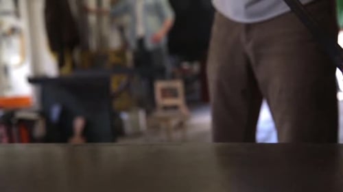 Glass Blower Rolling Hot Glass on Rod in Workshop 3034 Years