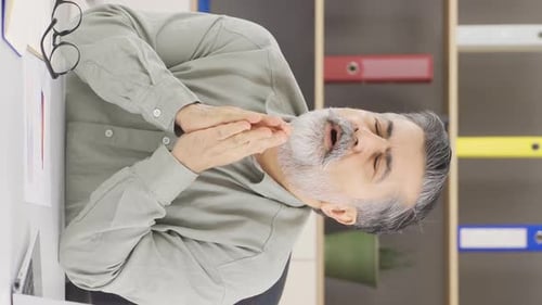 Mature Adult with Gray Hair at Workplace