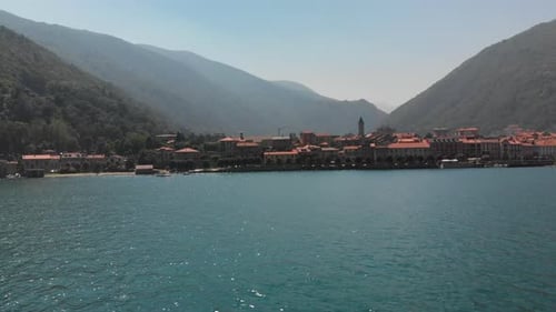 Aerial tracking shot with a view of lakeside of Cannobio, Italy,