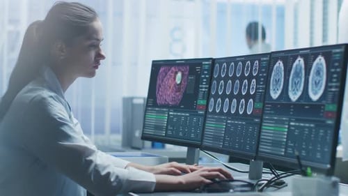 Female Doctor Analyzing Brain Scans in Modern Lab