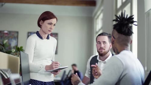 Young business team brainstorming startup ideas in modern office space