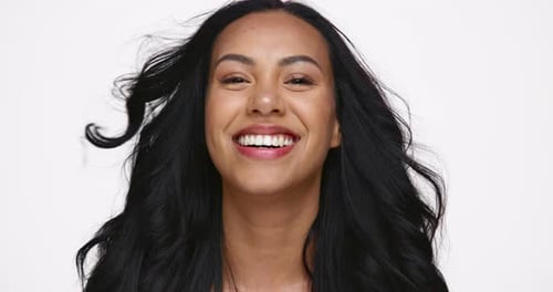 Young Brunette Woman Smiling and Looking at Camera