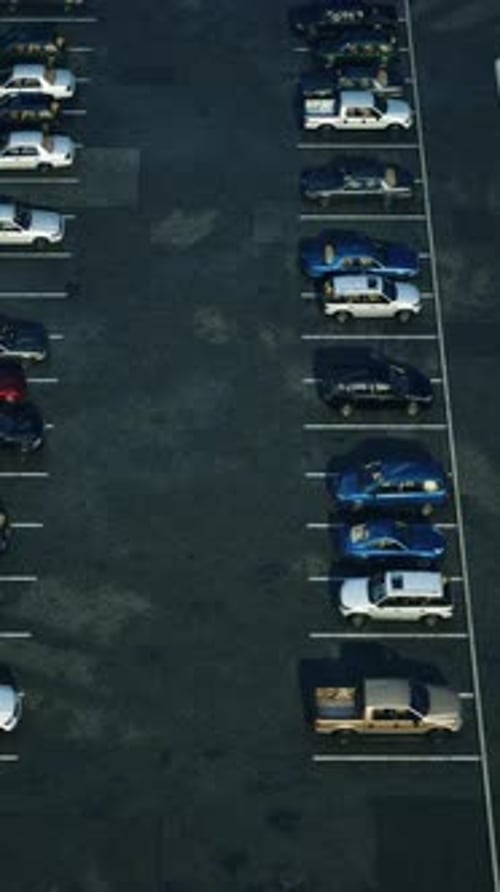 A Crowded Parking Lot Overflowing With Parked Cars