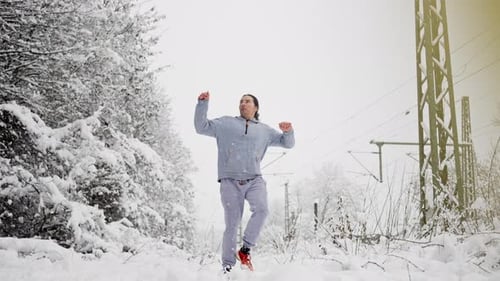 Asian Athlete Executing Front Kick Snow Powerful Front Kick Demonstration In Snowy Woods Near
