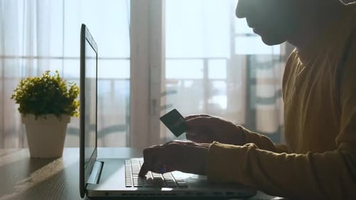 Young Adult Shopping Online Using Credit Card