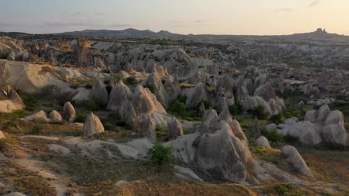 Epic cinematic drone shot going through the fairy chimneys and the rocks in Cappadocia, Turkey