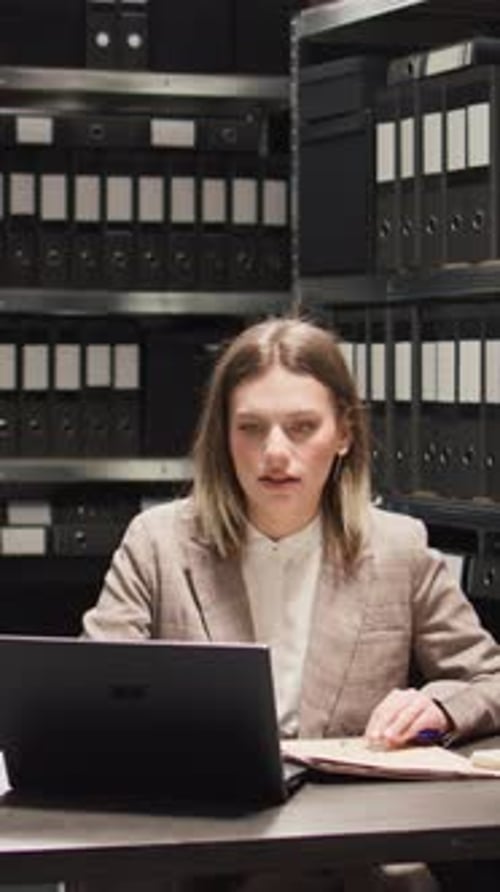 Woman Working at Desk in an Office