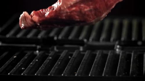 The Ribeye Steak Falls Into the Pan Filmed on a Highspeed Camera at 1000 Fps
