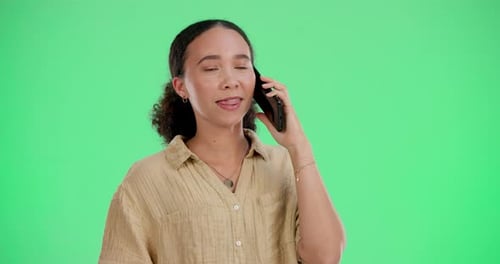 Happy, woman and talking with phone call on green screen for communication