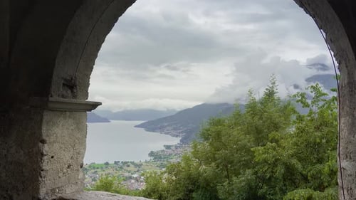 Landscape of a Lake in the Mountains Opens Up Behind the Ancient Walls