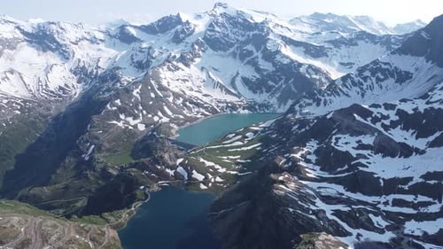 Aerial view of snow-capped mountains and lakes, Switzerland.