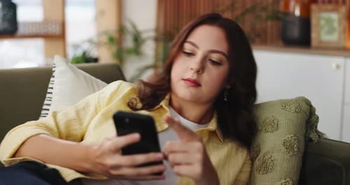 Break, phone and social media with woman on sofa in living room of home for post or update