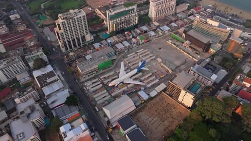 Parked aircraft seen from above near urban resorts in Pattaya, Thailand