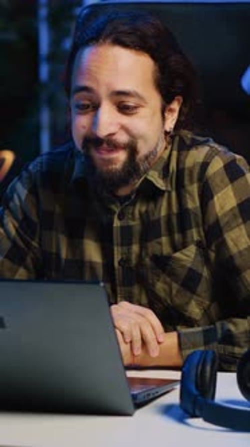 Young Man Using Laptop for Video Call Indoors