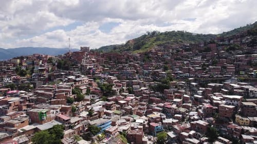 Aerial view of Comuna 13, showcasing the densely packed colorful homes nestled in the Medellin hills