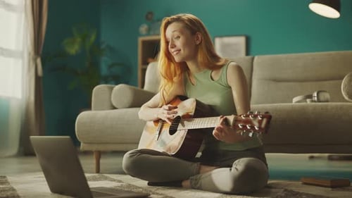 Woman Plays Guitar in Home Living Room