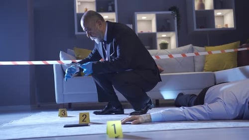 Investigator Inspecting Crime Scene Evidence at Night