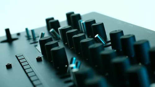 Finger Adjusting Dial on Sound Mixing Equipment