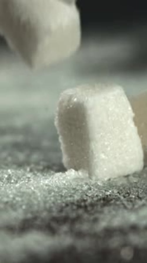 Sugar Cubes Fall on the Table Filmed on a Highspeed Camera at 1000 Fps