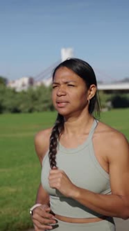 Slow Motion of Latina Young Fit Woman Running in a City Urban Park Female Effort Workout