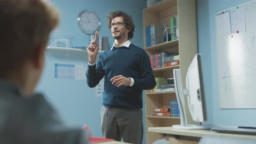 Teacher Explaining Lesson with Marker in Classroom
