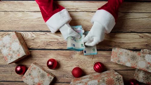 Santa Claus Counting Money for Christmas Presents