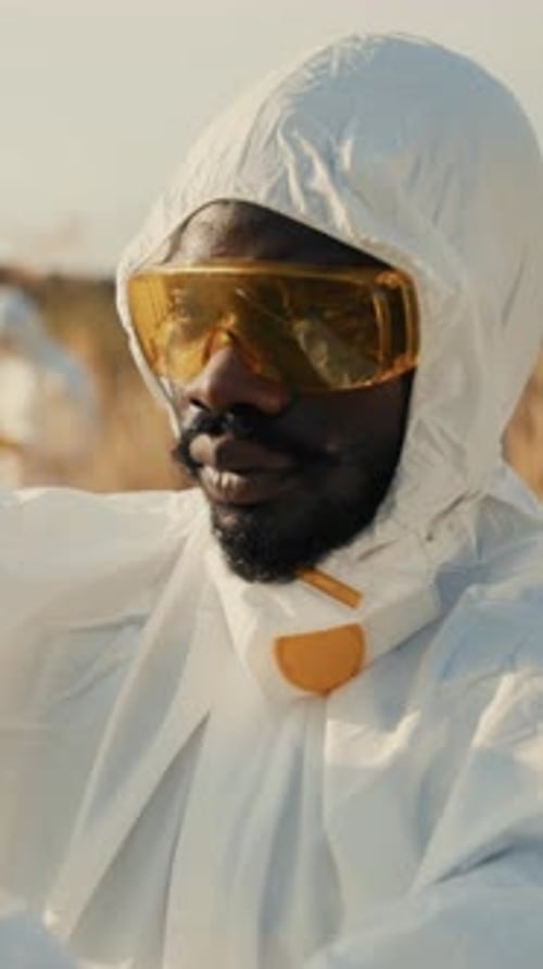 Person in Hazmat Suit Standing Outside