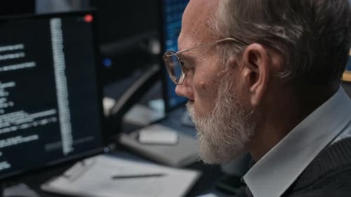 Late Night Office Coding by Senior Software Developer