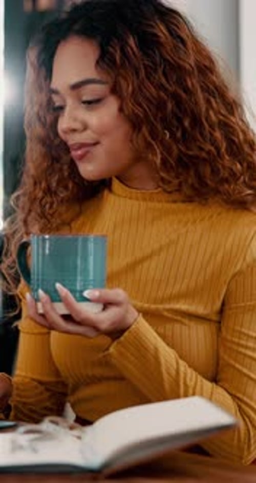 Agenda, coffee and remote work with woman in home office for development, reading or research