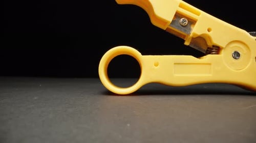 Wire stripper. Dolly slider extreme close-up.