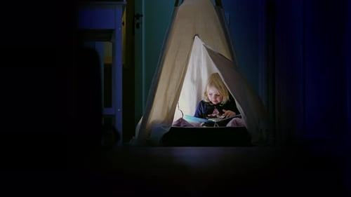 Adorable Girl Reading Book in Cozy Indoor Tent