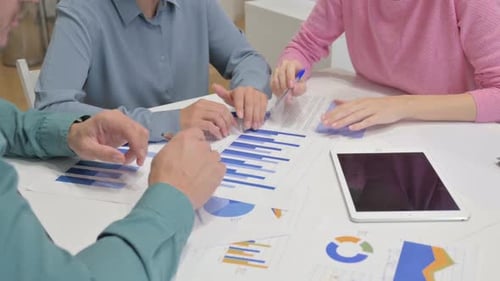 Close Up of Casual People Working on Documents