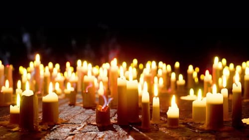 Warm Candlelight Flames Flickering in a Mystical Dark Scene