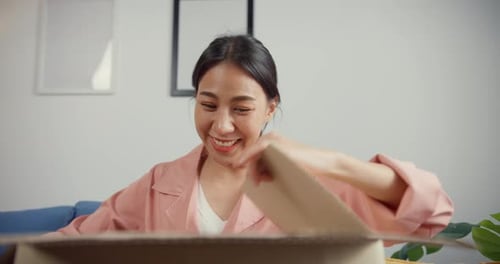 Woman Receives Surprise Package with Joy Indoors