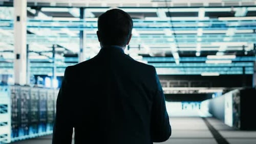 Writing Code Tablet Closeup and Engineer in Data Center