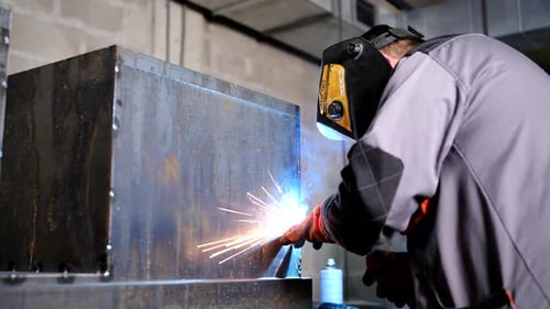 Welder working and soldering iron with mask - slider shot