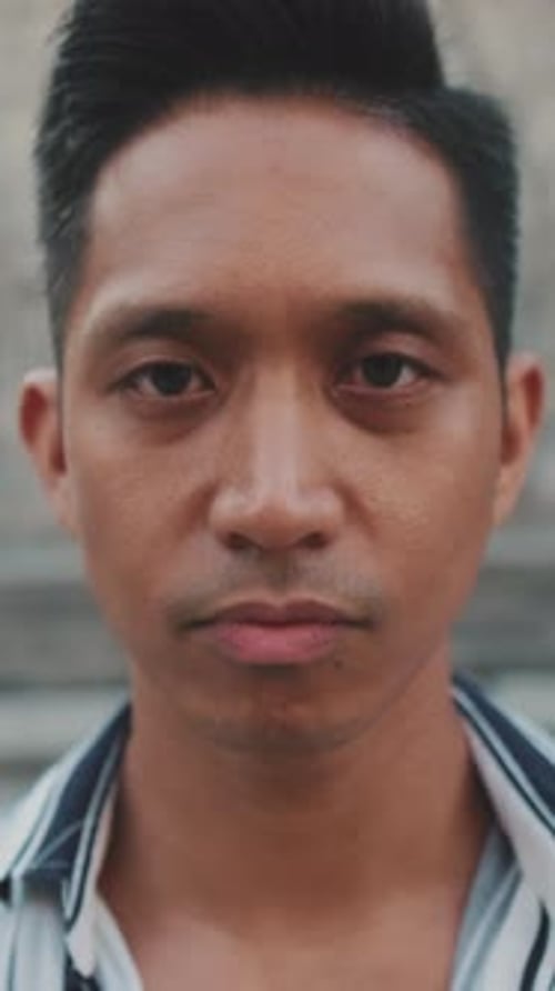 Close-up of young man tourist looking at the camera
