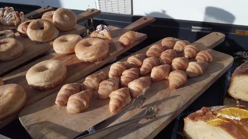 Delicious Donuts and Pastries Displayed in Daylight