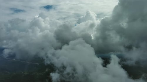 Flying Through White Fluffy Clouds
