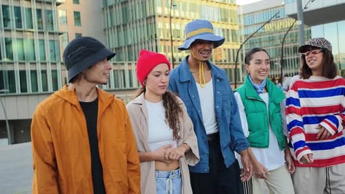 Group of Diverse Friends Enjoying a Lively and Cheerful Moment While Walking Together in the City