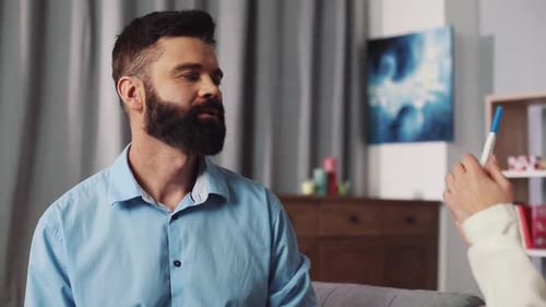 Couple Reacting to a Positive Pregnancy Test Result