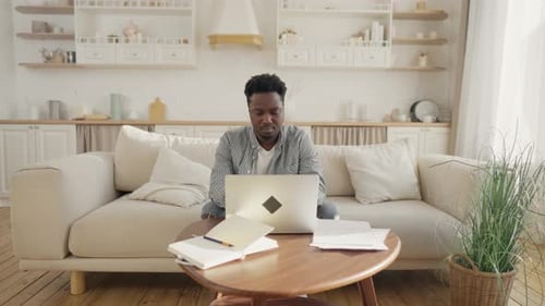 Adult Man Working on Computer in Home