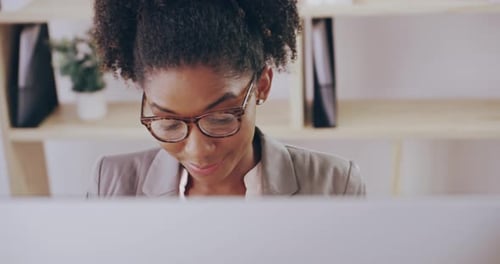4k video footage of a young attractive businesswoman working in her office