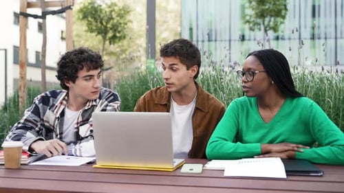 Multiethnic University Student Friends Working on Laptop Preparing for Exams