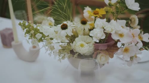 Elegant Floral Arrangement on White Table for Wedding