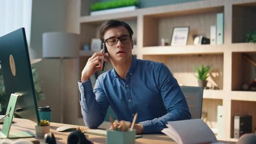 Serious Entrepreneur Talking Mobile Phone in Office Eyeglasses Manager Calling
