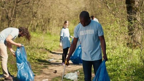 Volunteers Picking Up Trash in Rural Environment